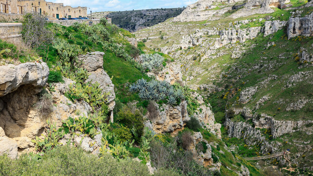 Stone Arch Framing Murgia Canyon View in Matera