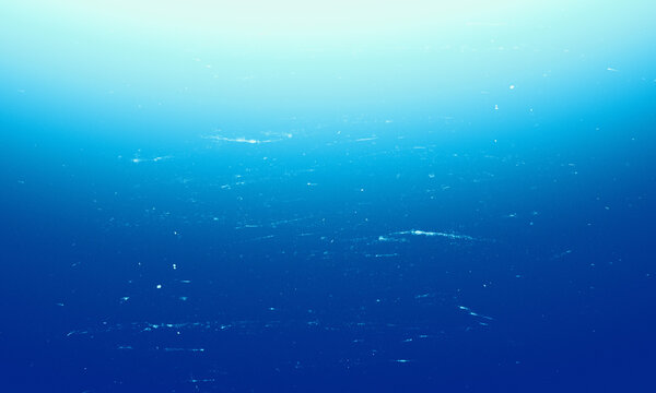 Abstract blue background with subtle gradient vignette and vintage dusty film grain texture Background