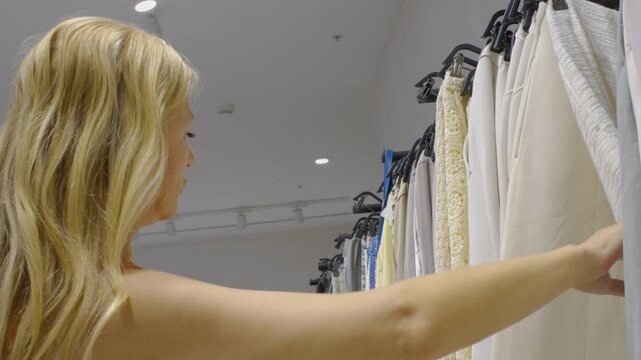 A woman is shopping in a boutique.
