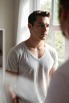 Interpersonal communication and emotional connection, young man listening to a partner during a serious conversation in a bright home interior setting