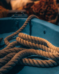 Coiled Hemp Rope in Blue Wooden Boat Close-Up, Mediterranean © Agostino