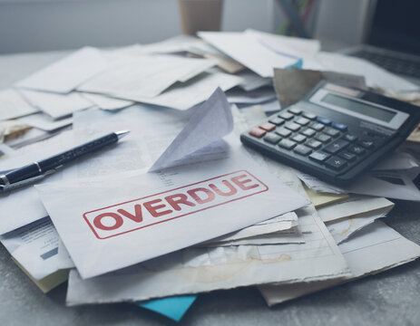 Overdue Bill Stack: A close-up of a messy pile of bills and documents, with a prominent OVERDUE stamp indicating financial troubles. A sense of stress and urgency emanates from the image.