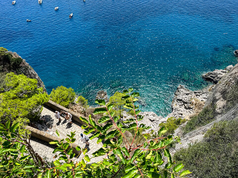 High Angle View of Winding Via Krupp Footpath in Capri, Italy. A striking overhead perspective of the historic Via Krupp, a paved stone footpath carved into the cliffs with dramatic switchback turns. 