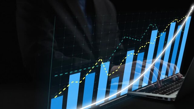 A business professional reviews growth data on a laptop screen, featuring dynamic graphs and charts. The dark background emphasizes the analytical process. Copula