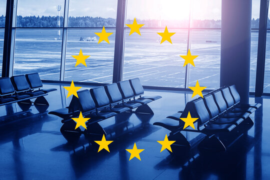 Airport terminal waiting area with yellow European stars over empty passenger seats. EU travel regulations view. Modern transport background.