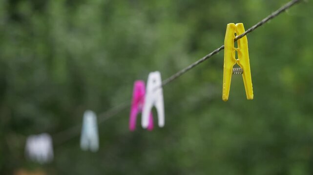 Plastic Peg on Clothesline Moving in Wind Outdoor Shot