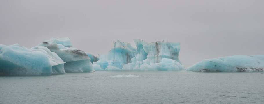 landscape with ice rocks in glacier lake of J&ouml;kuls&aacute;rl&oacute;n in Iceland