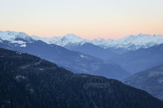 sunrise in the snowcapped alps mountains