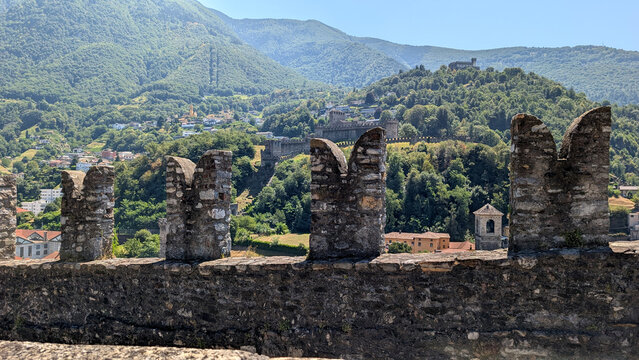 View through medieval battlements toward Bellinzona fortification. 