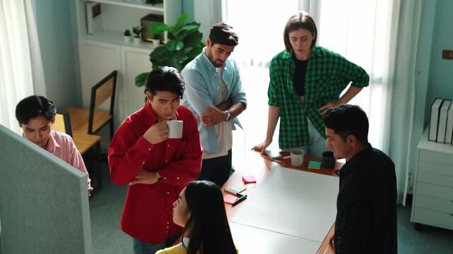 Top view of smart business team explain and discuss about plan at meeting table with sticky notes. Group of diverse people brainstorming idea at boardroom while standing at meeting table. Convocation.