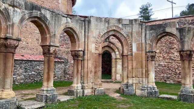 Ancient cloister arches of san juan de duero monastery in soria, spain