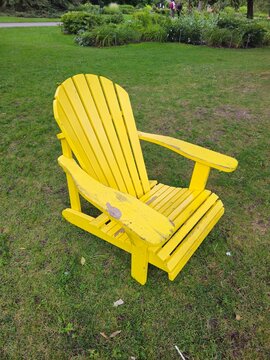 Wooden Muskoka Chair on Green Grass in Canada