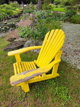 Wooden Muskoka Chair on Green Grass in Canada