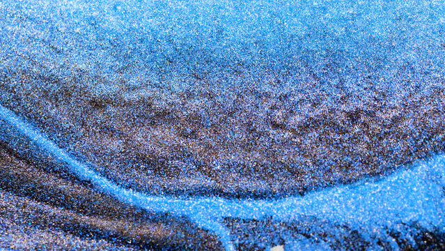 Mixing colors in macro view of alcohol ink fragments in creative process