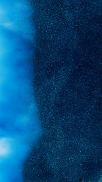 Mixing alcohol ink creates colorful patterns in abstract art