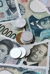 Japanese yen money banknotes and coins on table. Japan cash bills of JPY currency © Viktor