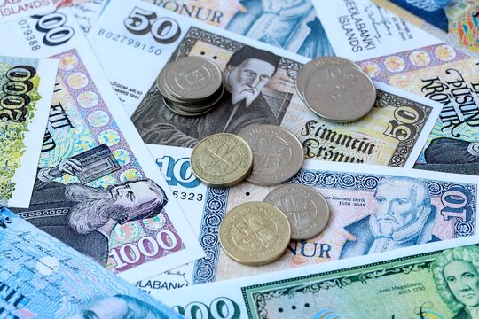 Icelandic krona money banknotes and coins on table. Iceland cash bills of ISK currency