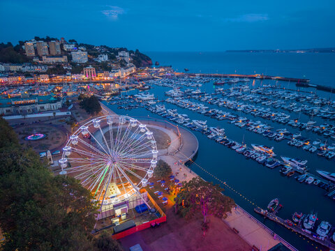 Torquay, Devon, United Kingdom. 08.26.2026 Torquay Marina shines bright across the English Riviera during dusk. 26th August 2026.