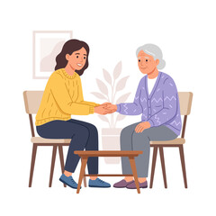 Obraz premium Generational connection, young woman and grandmother holding hands, symbolizing care, support, and family bonds in a cozy indoor setting.