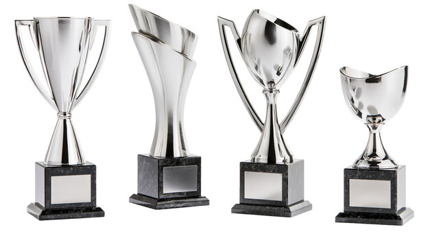 Isolated group of four shiny silver metal trophies representing victory and excellence