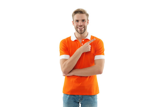 Millennial portrait. Young man isolated on white. Stylish young man portrait. Casual style man pointing finger. Guy has stylish haircut. Young man wearing casual tshirt. Casual male style portrait
