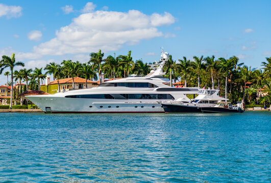 Sea vacation on summer. Luxury boat motor yacht in marina. Luxury yacht. Boating and yachting tourism. Luxurious lifestyle. Summer vacation. Docked yacht at private area