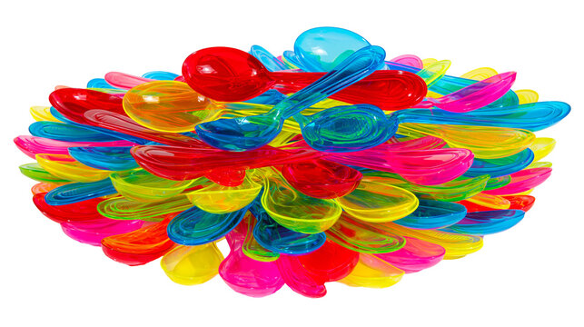 Isolated vibrant pile of multicolored translucent plastic spoons for party and picnic fun