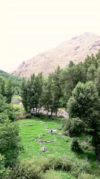 Marrakech, morocco. August 9, 2026. Beautiful panoramic view of the ourika valley in the high atlas mountains of morocco, showing a lush green landscape with a river flowing