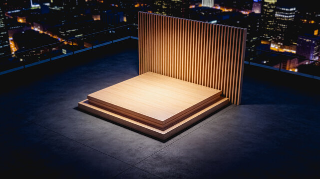 A minimalist empty wooden platform with slatted backdrop sits on a rooftop at night, overlooking a lit urban cityscape.