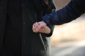 Fototapeta premium A man and a woman holding hands affectionately