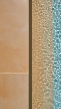 Soft Pool Water Reflections Moving Across Beige Stone Wall