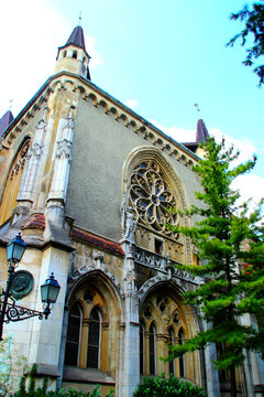 BUDAPEST, HUNGARY - AUGUST 31, 2025: Vajdahunyad Castle. Its picturesque facade features a blend of towers, arched windows, and intricate details that evoke a fairytale charm, surrounded by greenery