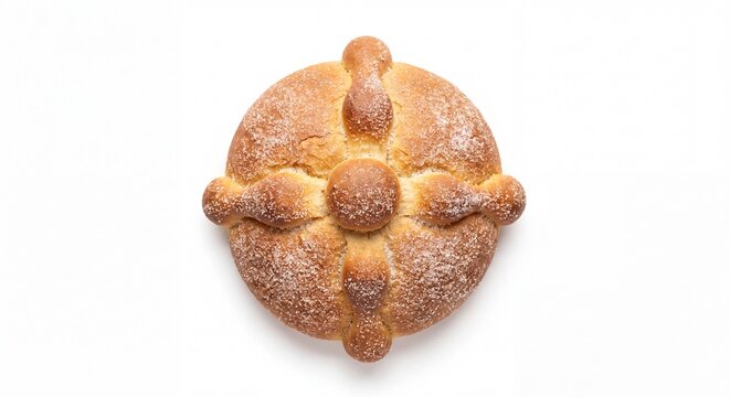 A traditional Mexican Pan de Muerto bread roll featuring a round shape with bone-like dough accents.