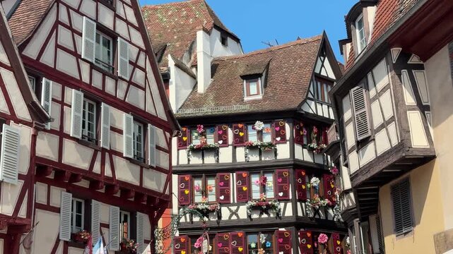 Colorful half timbered buildings in the historic city center of Colmar, a famous town in the Alsace region of France on a sunny day