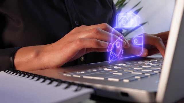 Financial boost for new businesses. Close-up of a businesswoman working on her computer, featuring a virtual icon of a wallet with a rocket.
