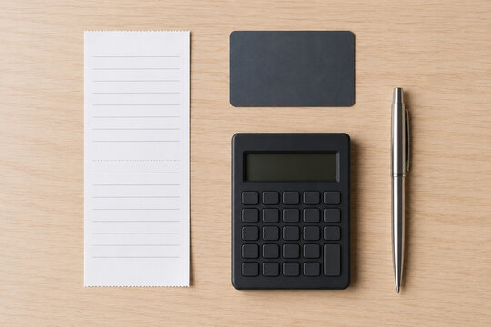Expense Review Desk with Blank Receipt and Calculator