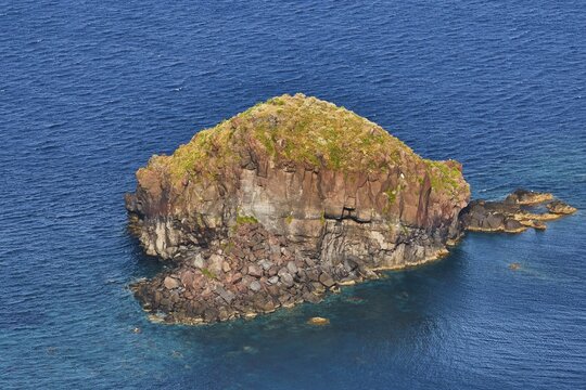 Pollara Bay, Salina Island, Large rocky island surrounded by deep blue seawater, under clear sky, UNESCO World Heritage Site, Aeolian Islands, Aeolian Islands, Sicily, Italy