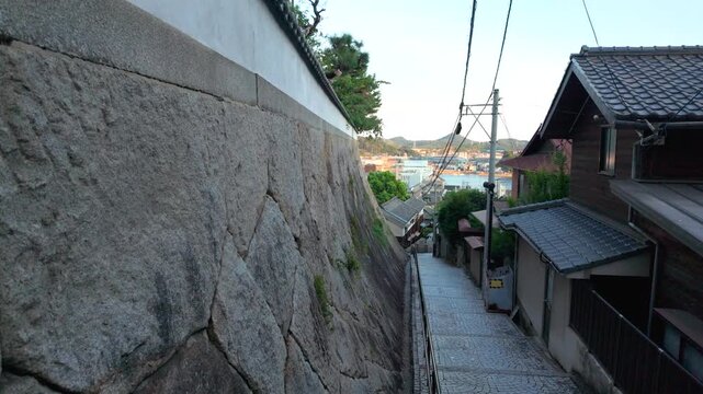 Narrow Alley Through Traditional Hillside Neighborhood in Onomichi, Japan