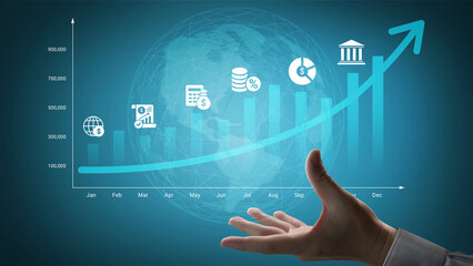 A hand reaching out toward a rising graph and financial symbols on a blue background, representing...