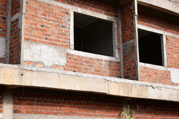 Obraz premium exterior view of brick house under construction with concrete structure