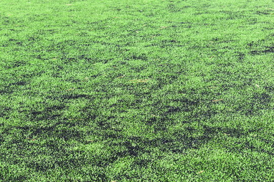 close up of clean green synthetic grass lawn surface