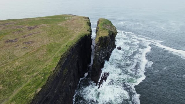 Drone Shot of Loop Head Peninsula Cliffs and Rock Stack Above Atlantic Ocean, Ireland