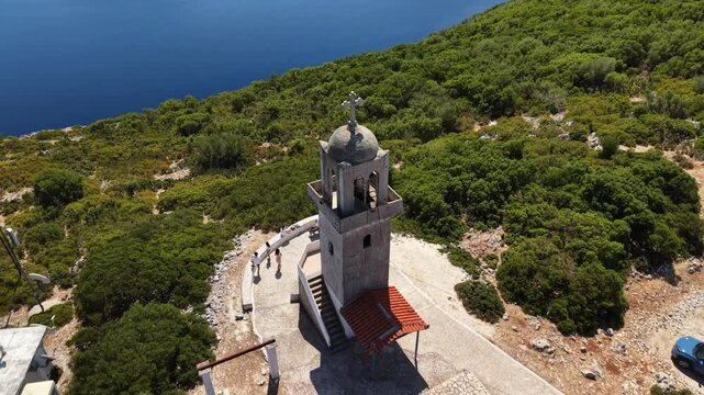Stunning drop height and reveal Vathy bay by drone from Kathara Monastery, Ithaca, Greek Islands