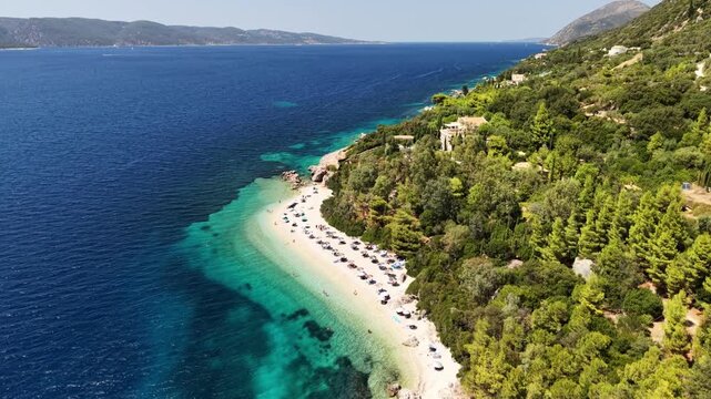 Famous and jaw-dropping Aspros Gialos beach, Ithaca, Greek Islands - drone flyover from south