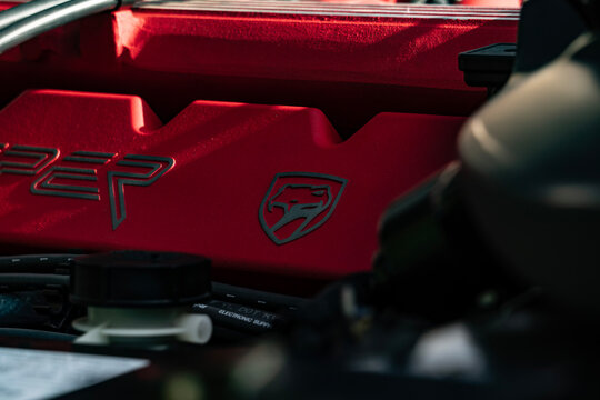 Close-Up View of a Dodge Viper Red V10 Engine Manifold and Emblem