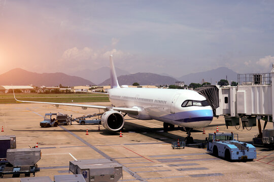 Airplane at the terminal gate ready for take off Modern international airport - Concept of emotional travel around the worl