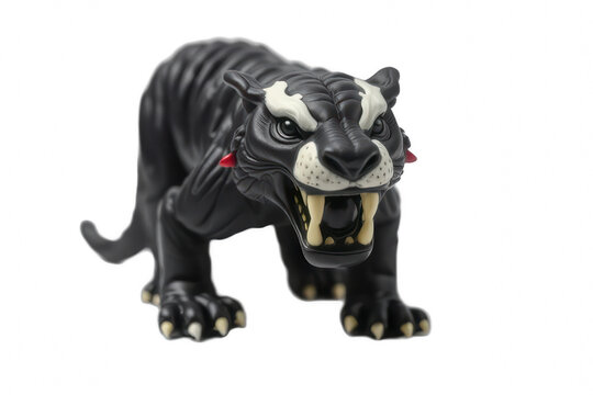 Black toy saber-toothed tiger figure isolated on black background