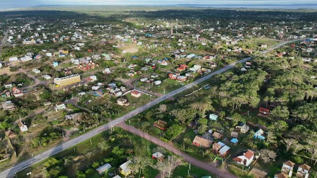 Punta del Diablo residential neighborhood aerial forward push over houses and greenery in Rocha, Uruguay