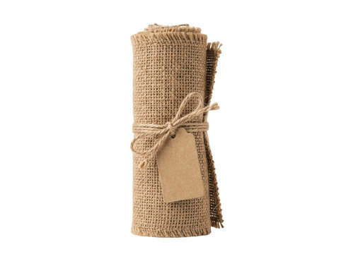 Rustic burlap fabric roll tied with twine and a blank kraft paper gift tag isolated on a transparent background