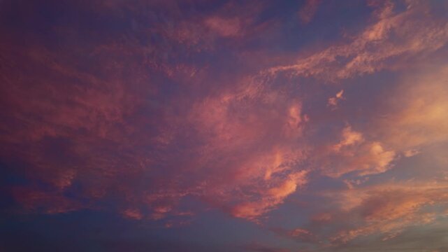 Warm Golden Light Glows Across The Clouds And Sky During Sunrise. Low-angle Shot